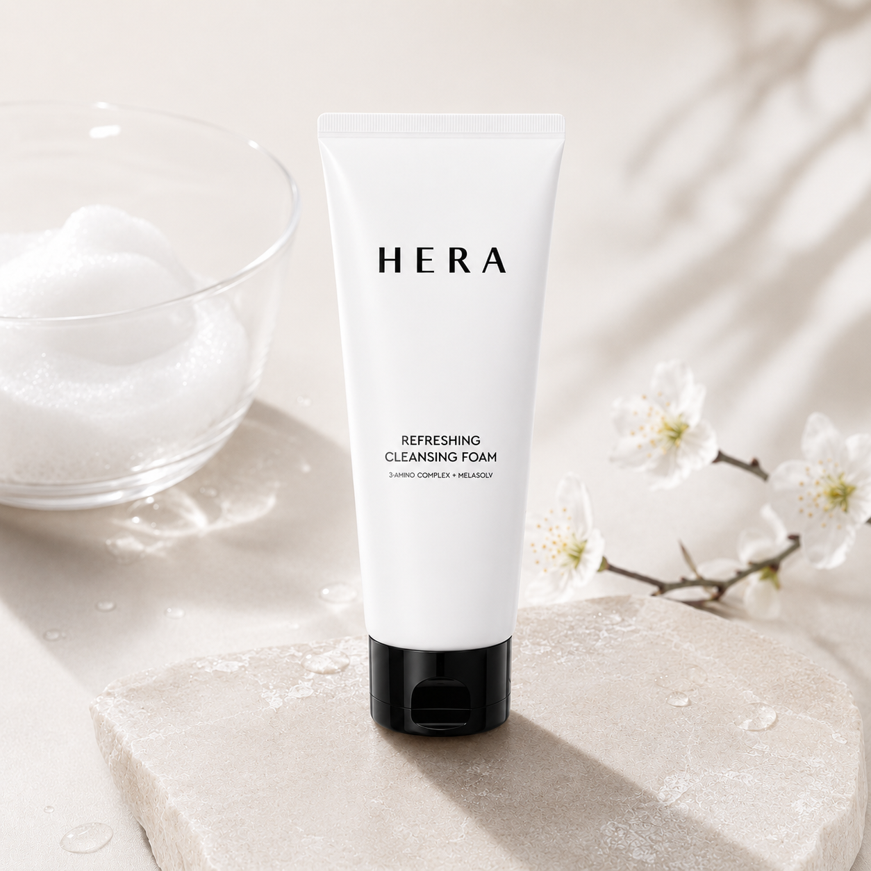 HERA Refreshing Cleansing Foam facial cleanser tube with creamy cleansing texture and exfoliating pink beads